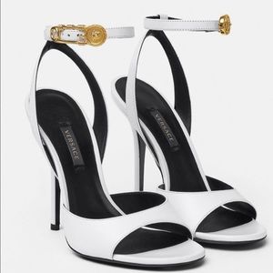 Brand new Versace safety pin shoes with box size 40.  Never worn